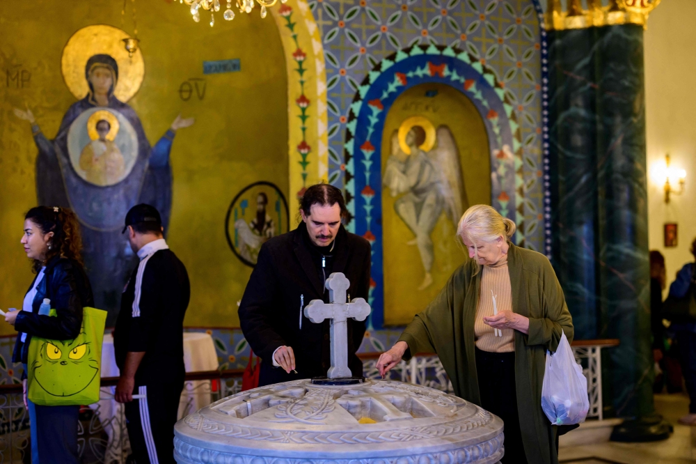 The line outside Istanbul's Our Lady of Vefa church stretches more than 200 metres, the crowd a mix of Christians and Muslims chatting animatedly as they wait to make a wish inside this Greek Orthodox sanctuary. — AFP pic