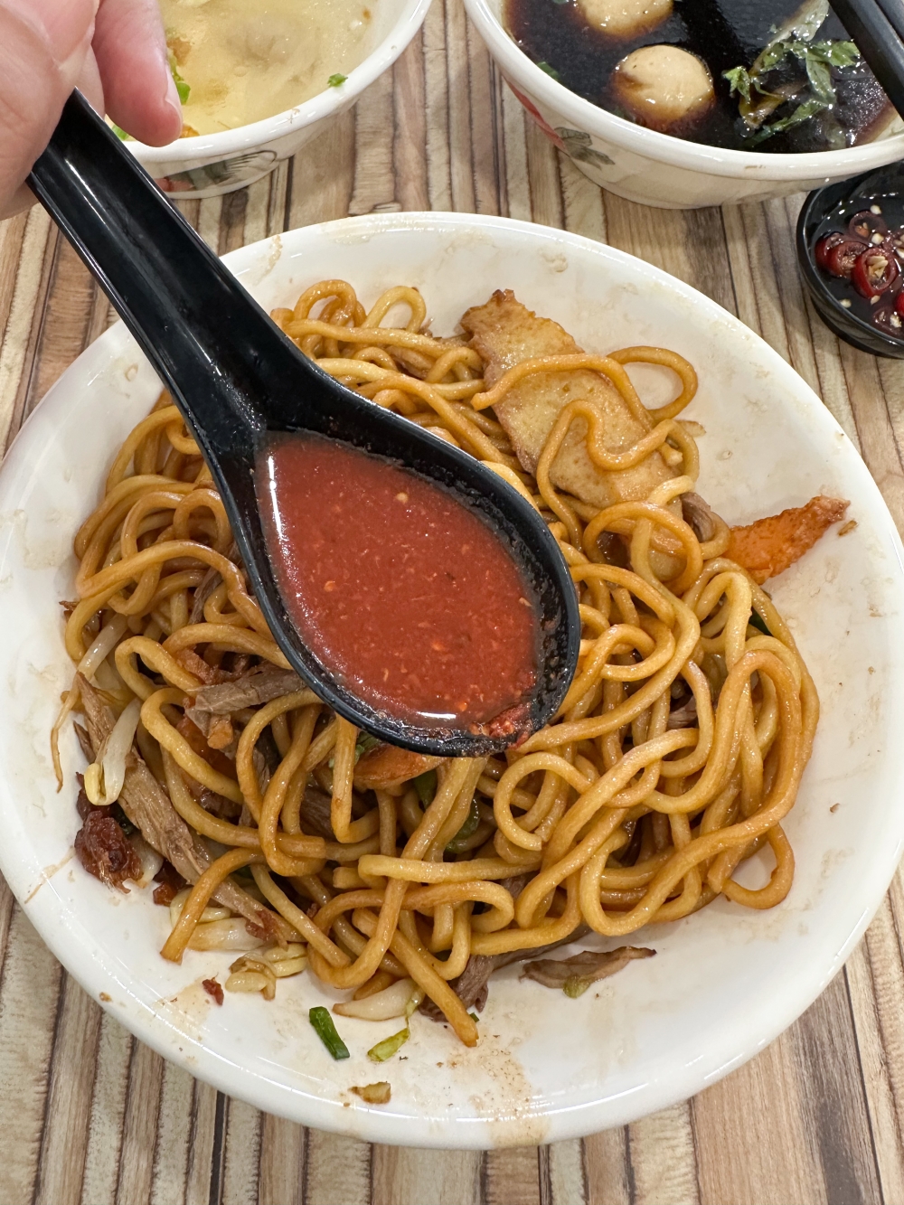 Add the 'cili botol' to give the soy sauce mixture a hint of spiciness and touch of tanginess for your noodles. — Pictures by Lee Khang Yi