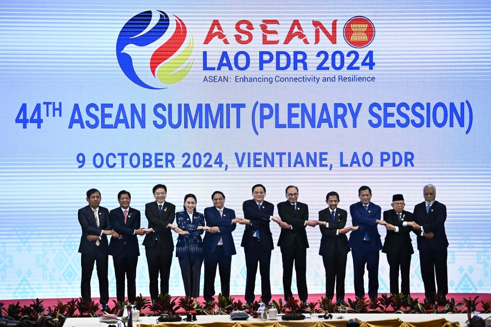 (L-R) Myanmar's Permanent Secretary of Foreign Affairs Aung Kyaw Moe, Philippines' President Ferdinand Marcos Jr, Singapore's Prime Minister Lawrence Wong, Thailand's Prime Minister Paetongtarn Shinawatra, Vietnam's Prime Minister Pham Minh Chinh, Laos' Prime Minister Sonexay Siphandone, Malaysia's Prime Minister Anwar Ibrahim, Brunei's Sultan Hassanal Bolkiah, Cambodia's Prime Minister Hun Mamet, Indonesia's Vice Prime Minister Ma'ruf Amin and East Timor's Prime Minister Kay Rala Xanana Gusmao pose on stage during the 44th Association of Southeast Asian Nations (ASEAN) Summit in Vientiane on October 9, 2024. — AFP pic