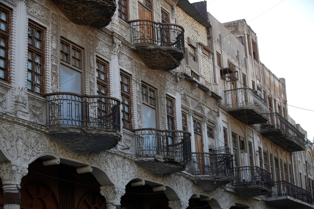 This picture shows a view a historic building on Rashid Street in central Baghdad on September 10, 2024. On the eastern bank of the Tigris, brutalist buildings from the 1960s stand alongside elaborate facades from the 1920s, decorated with flowery mouldings and sagging wrought-iron balconies. — AFP pic