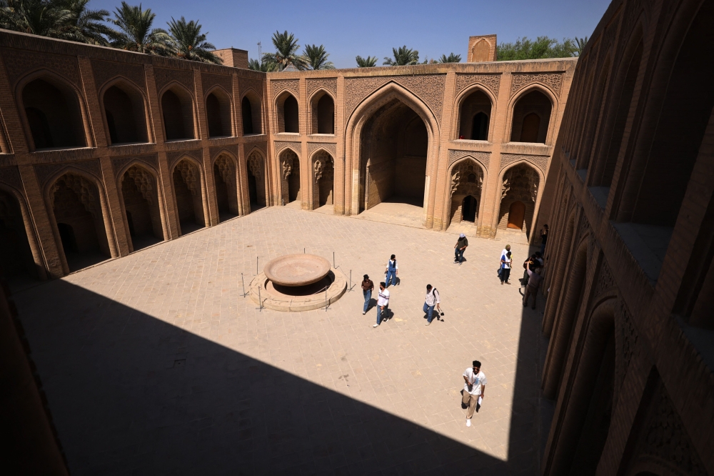 Students visit the 800 year-old Abbasid Palace in Baghdad on September 10, 2024, during a tour organised by a young architect's club aimed at exploring the historic sites of the old city of the Iraqi capital. — AFP pic