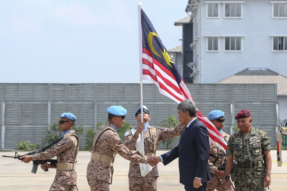 Malaysia’s Defence Minister Datuk Seri Mohamad Hasan shakes hands with a member from the first batch of Malaysian Battalion 850-11 armed force for the United Nations Interim Force in Lebanon (Unifit) at the Subang Air Base November 2, 2023. — Picture by Yusof Mat Isa 