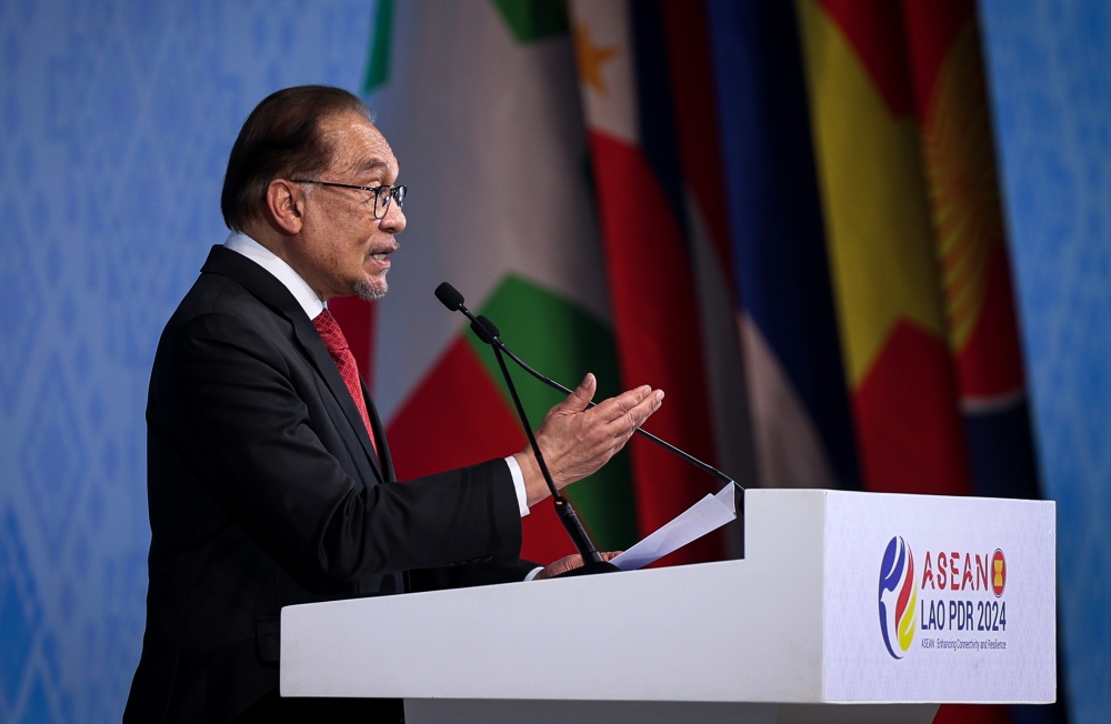 Prime Minister Datuk Seri Anwar Ibrahim delivers a speech during the closing ceremony of the 44th and 45th Asean Summits and Related Summits at the National Convention Centre (NCC) in Vientiane October 11, 2024. — Bernama pic