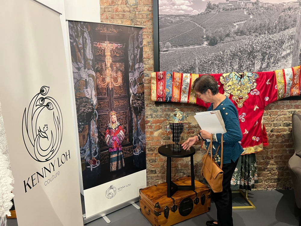 A visitor takes a close-up look at the exhibits on display at the “Road to Unesco- Nyonya Sarong Kebaya” in Penang on October 12, 2024. — Picture by Opalyn Mok