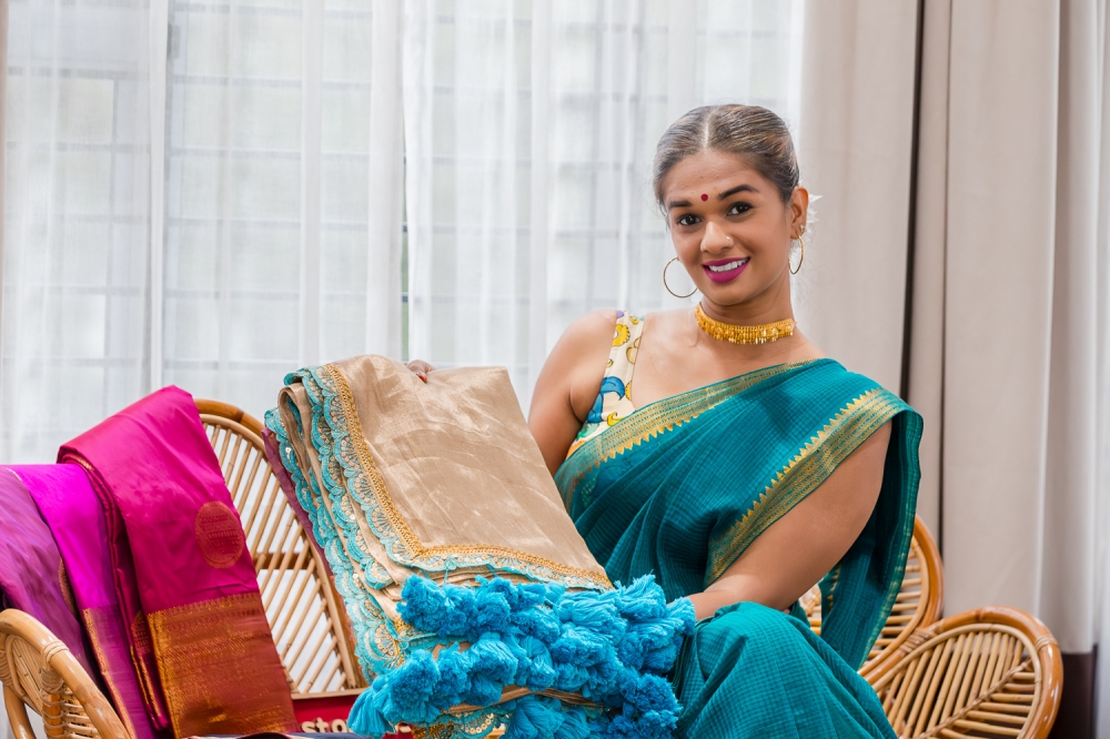 Shamini, founder of Cottonstories, showcases a selection of sarees at her studio in Shah Alam October 5, 2024. — Picture by Raymond Manuel