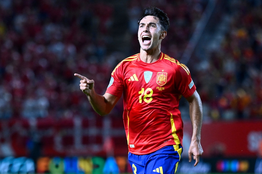 Spain’s Martin Zubimendi celebrates scoring the opening goal during the Uefa Nations League, League A Group 4 match against Denmark in Murcia October 12, 2024. — AFP pic