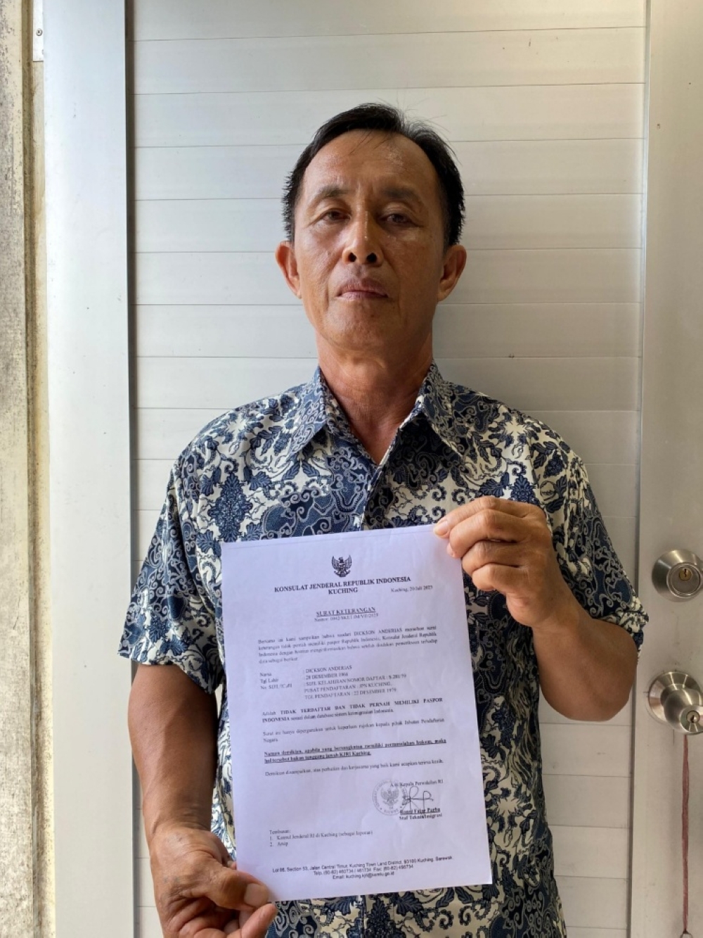 Dickson shows a letter from the Indonesian Embassy that confirmed that he does not have a passport issued by the republic. — The Borneo Post