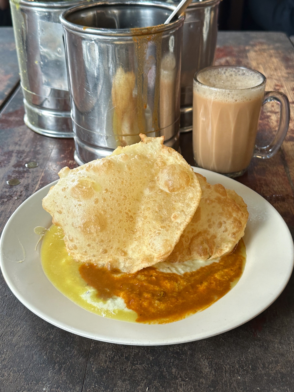 Fluffy golden ‘puri’ can be paired with dhal, curry and a scoop of coconut chutney. — Pictures by Lee Khang Yi