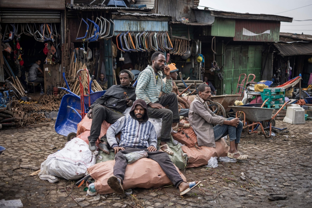 Informal waste collectors, known in Amharic as ‘korale’, lay on a pile of collected objects at the historical Merkato district of Addis Ababa October 1, 2024. — AFP pic