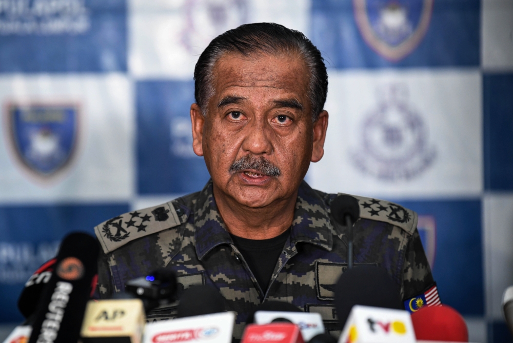 A file photograph shows Inspector-General of Police Tan Sri Razarudin Husain giving a press conference on GISB Holdings, in Kuala Lumpur on Sept 23, 2024. —Bernama pic