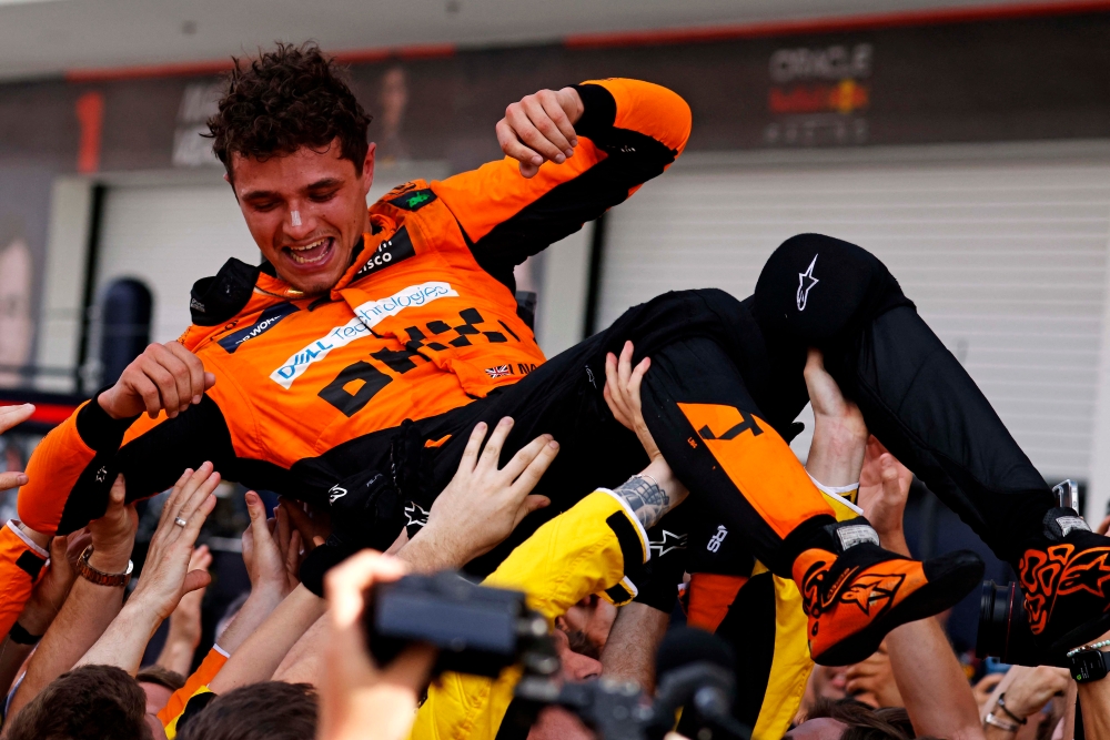 McLaren driver Lando Norris celebrates after winning the F1 Miami Grand Prix at Miami International Autodrome, Miami Gardens, Florida on May 5, 2024. — Reuters pic