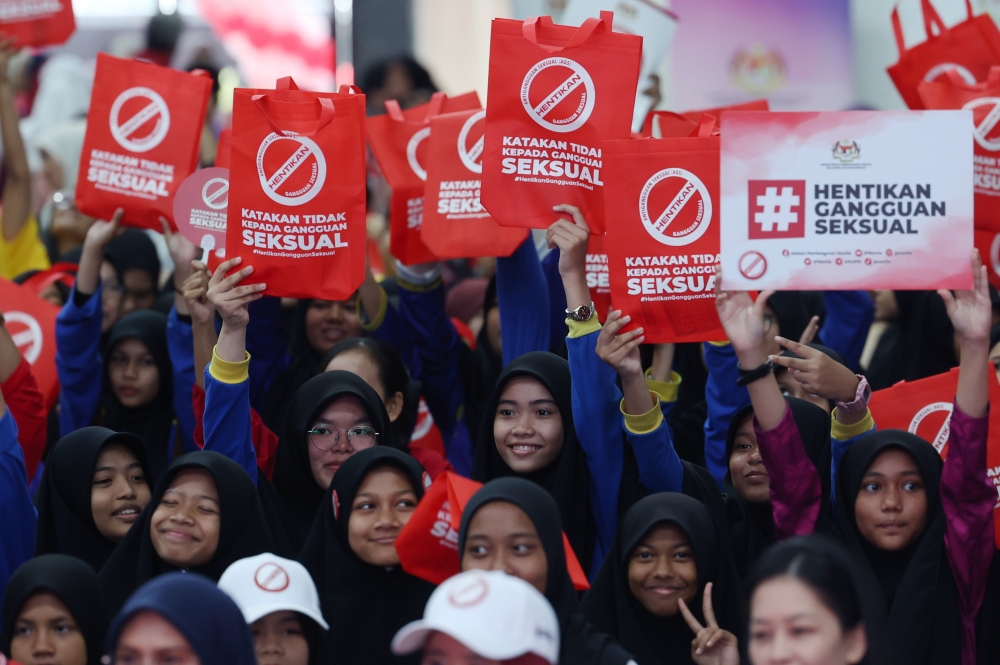 Students hold bags and placards against sexual harassment during the launch of the national-level Anti-Sexual Harassment Advocacy Roadshow in Putrajaya October 29, 2023. — Bernama pic