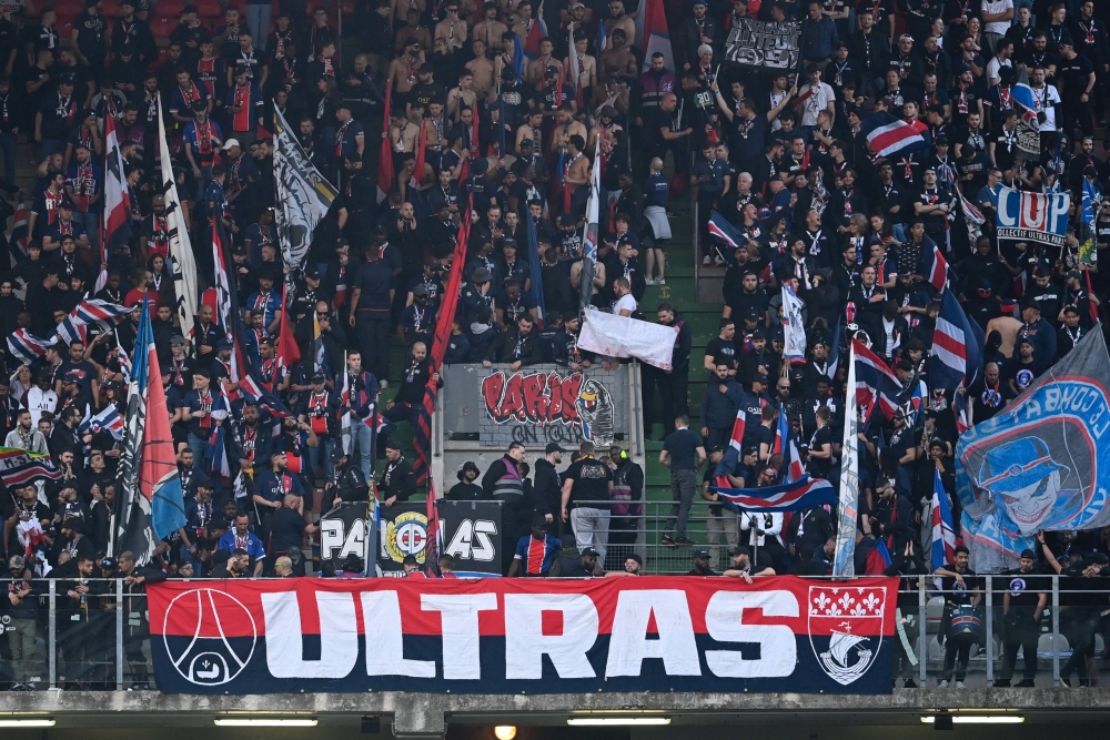 Paris Saint-Germain supporters wave flags ahead of the French L1 football match between FC Metz and Paris Saint-Germain (PSG) at the Saint-Symphorien Stadium in Longeville-les-Metz, eastern France, on May 19, 2024. — AFP pic