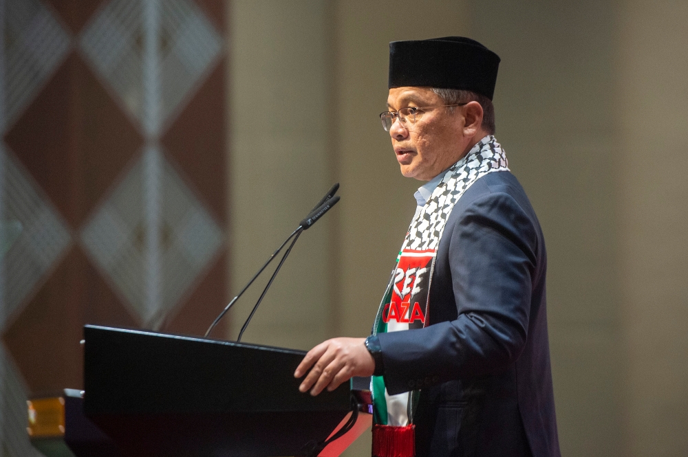 Minister for Religious Affairs Datuk Seri Mohd Na'im Mokhtar delivers his speech during Public Service Madani Colloquium at Putrajaya International Convention Centre (PICC) in Putrajaya November 8, 2023. — Picture by Shafwan Zaidon