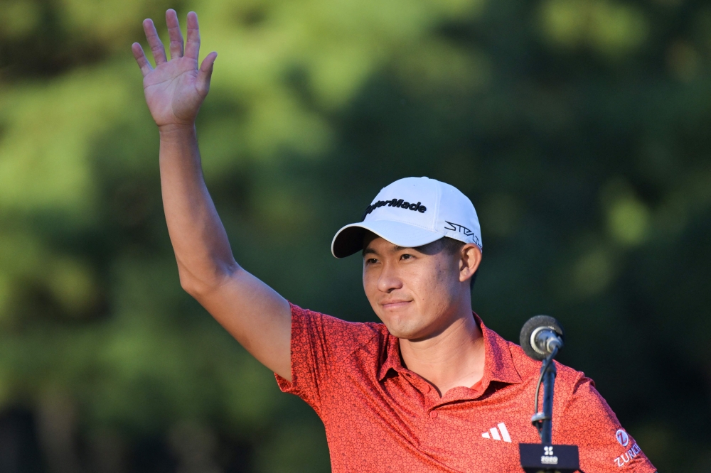 Collin Morikawa said it ‘meant the world’ to lift the trophy. — AFP pic