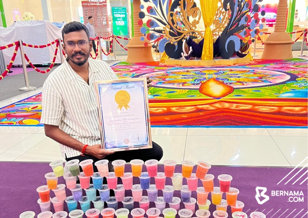 A. Sivabalan, the founder of Life Creation Rangoli Kolam Malaysia, recently etched his name in the Malaysia Book of Records (MBR) by creating a ‘kolam’ featuring one hundred colours at Nu Sentral. — Picture from X/Bernama  