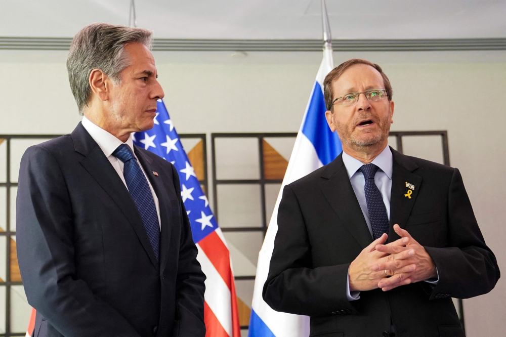 Israel's President Isaac Herzog and US Secretary of State Antony Blinken speak to reporters during a meeting in Tel Aviv on October 22, 2024. — AFP pic