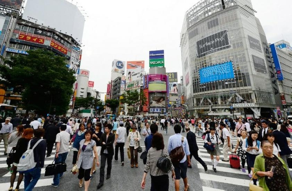 An undated file photograph shows people at a busy intersection in Tokyo, Japan. — AFP pic