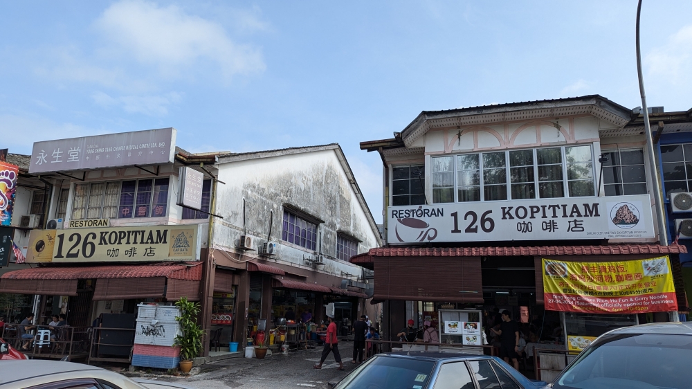 The ‘pan mee’ stall is in the shop on the right, while the ‘yong tau foo’ stall is in the shop on the left. — Picture by Ethan Lau