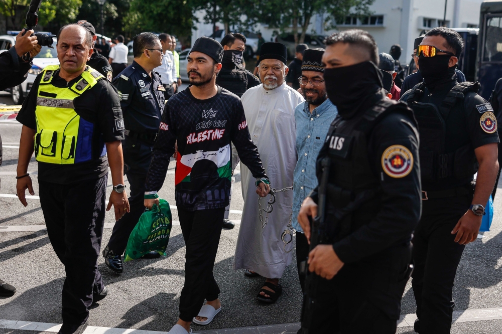 GISB Holdings Sdn Bhd CEO Datuk Nasiruddin Mohd Ali arrives with others to be charged with organised crime at the Sessions Court in Selayang, on Oct 23, 2024. — Bernama pic