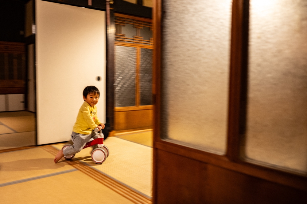 This photo taken on October 20, 2024 shows Kuranosuke Kato, son of Rie Kato and Toshiki Kato, playing in their house in the village of Ichinono in the city of Tamba-Sasayama, Hyogo Prefecture. — AFP pic 