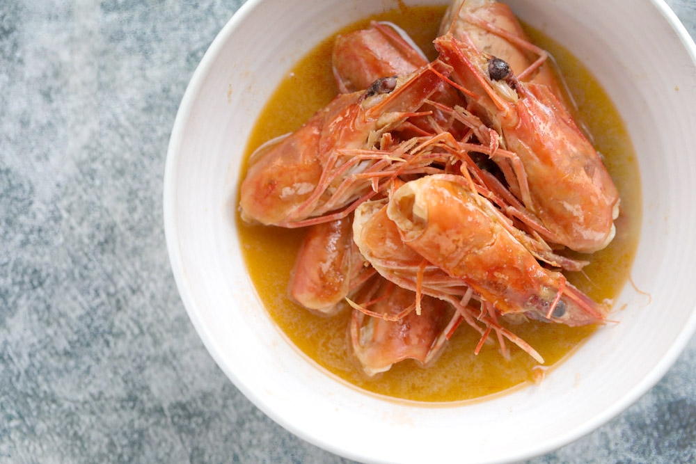 Cooked prawn heads with their precious broth. — Picture by CK Lim