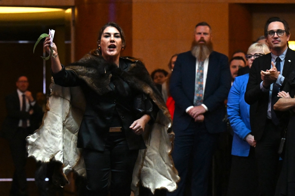 Australian Senator Lidia Thorpe disrupts proceedings as Britain's King Charles III and Queen Camilla attend a Parliamentary reception at Parliament House in Canberra October 21, 2024. — Lukas Coch/Pool/AFP pic