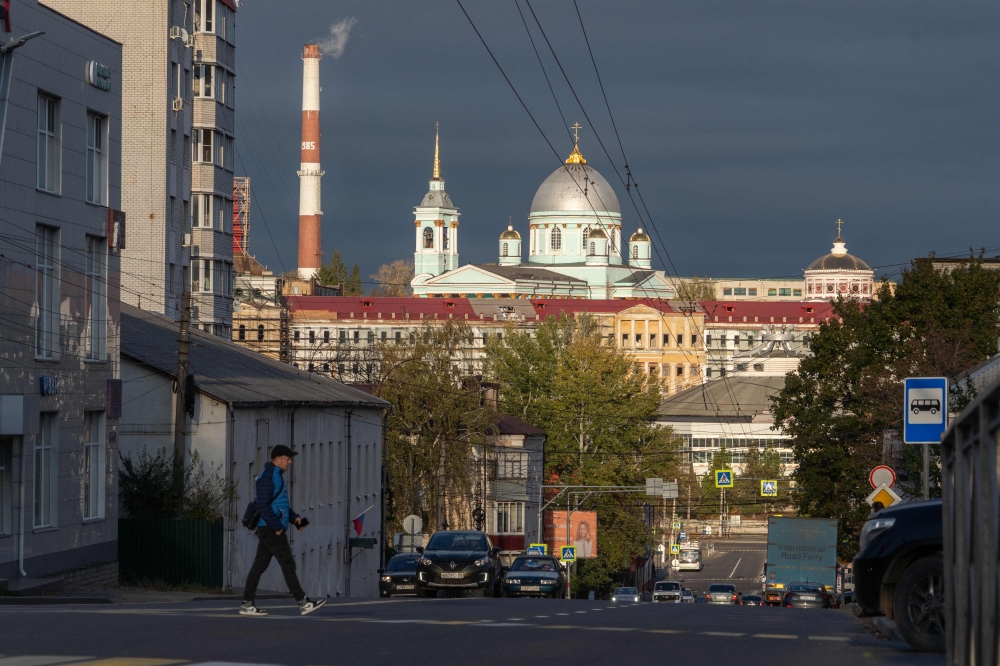 A man crosses a street in Kursk on October 17, 2024. — AFP pic