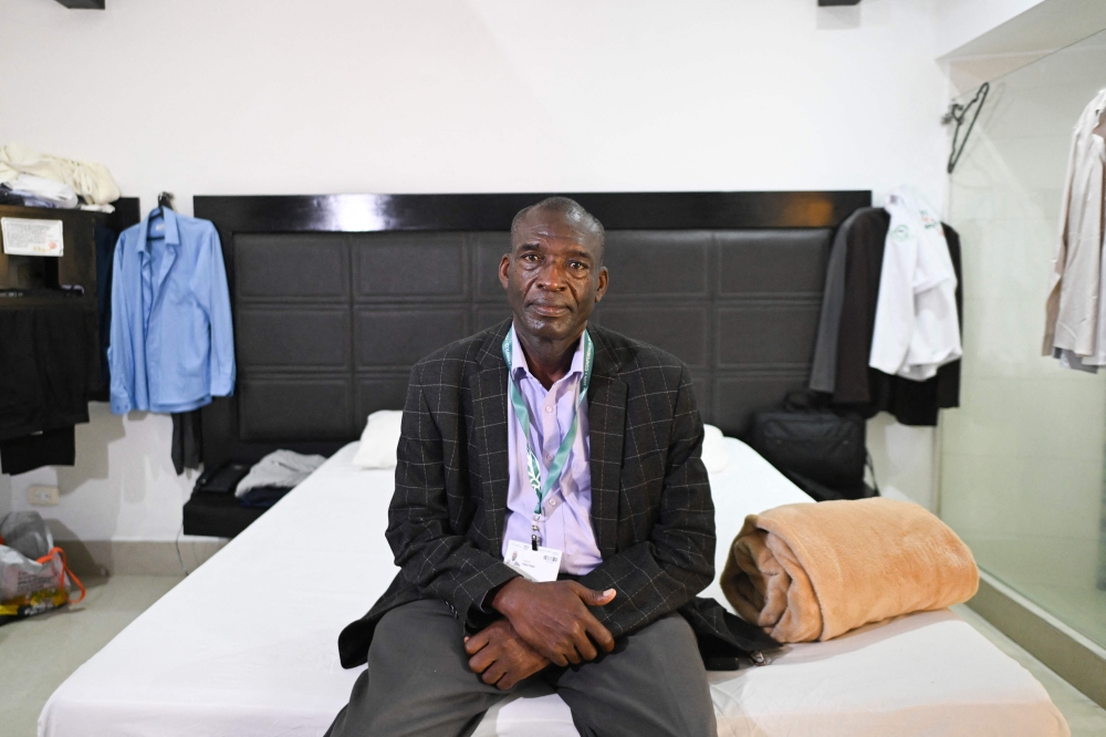 Aggrey Rwetsiba, representative of Uganda, poses for a picture in his room at Motel Deseos (Desires) in the framework of the COP16 summit in Cali, Colombia, on October 25, 2024. — AFP pic