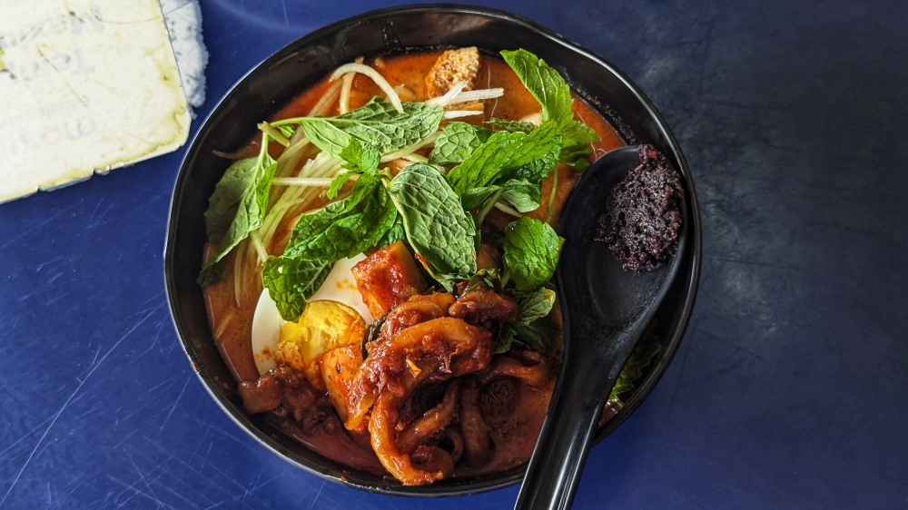 Nyonya ‘laksa’ isn’t usually my favourite variety of ‘laksa’, but Auntie Ling’s version packs plenty of punch. — Picture by Ethan Lau