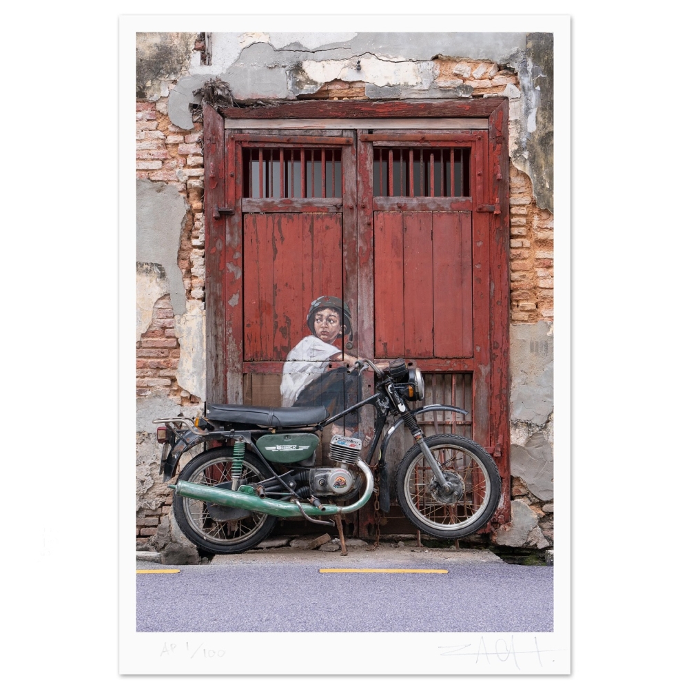 Mohammad Shahrul Aiman Mohamed is the model for the Boy On A Bike mural on Lebuh Ah Quee in George Town, Penang. — Picture from Facebook/Ernest Zacharevic 