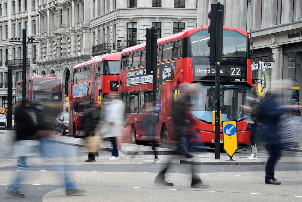 File photo of shoppers crossing the road at Oxford Circus, in the centre of London's retail shopping area in London October 19, 2020. The UK is among the costliest places to fill up. — Reuters pic