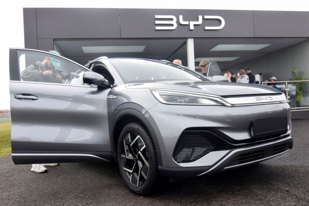 Members of the press and the general public check out the Atto 3 electric SUV made by Chinese carmaker BYD, at the Fully Charged Live electric vehicle trade show in Farnborough, Britain, April 28, 2023. — Reuters pic