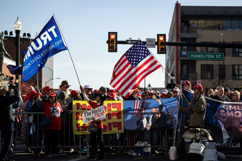 Supporters of former President and Republican presidential nominee Donald Trump begin lining up outside of the PPL Centre ahead of his campaign rally in Allentown, Pennsylvania on October 29, 2024. — AFP pic