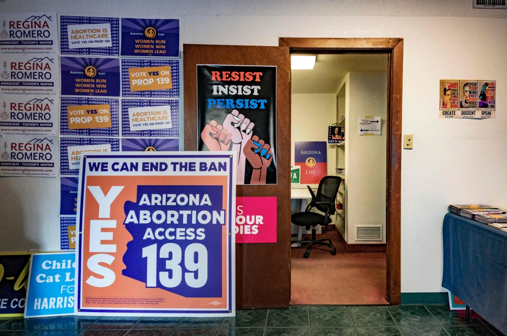 Sign in favor of proposition 139, the right to abortion initiative, are displayed at the entrance room of the Tucson HQ of Arizona List, an association made to empower and elect progressive pro-choice Democratic women leaders, in Tucson, Arizona, October 16, 2024. — AFP pic