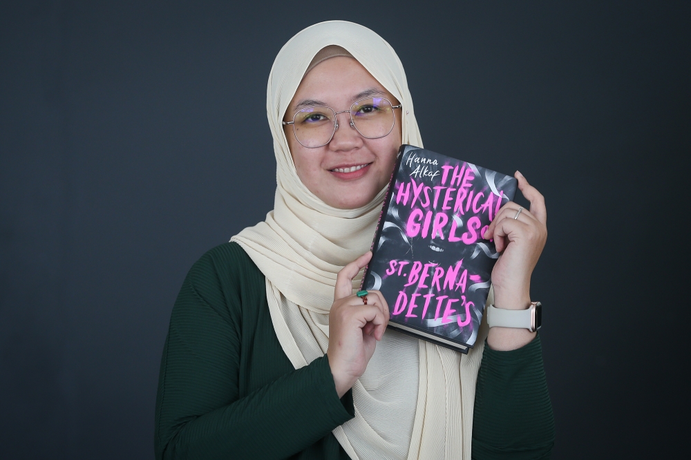 Hanna’s latest book, ‘The Hysterical Girls of St. Bernadette’s’, is already generating buzz. — Picture by Yusof Mat Isa