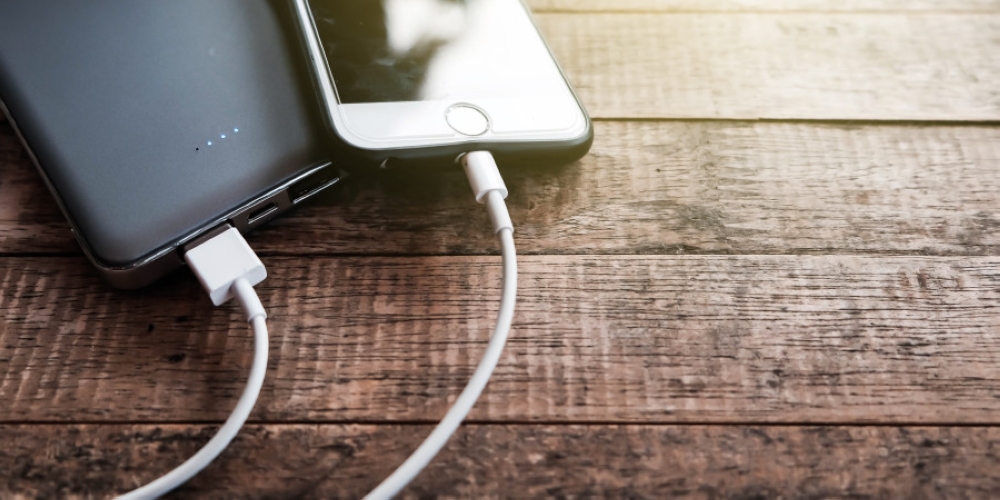 An illustrative photo shows smartphones connected to charging cables. — Picture courtesy of Chutharat Kamkhuntee / Getty Images via ETX Studio