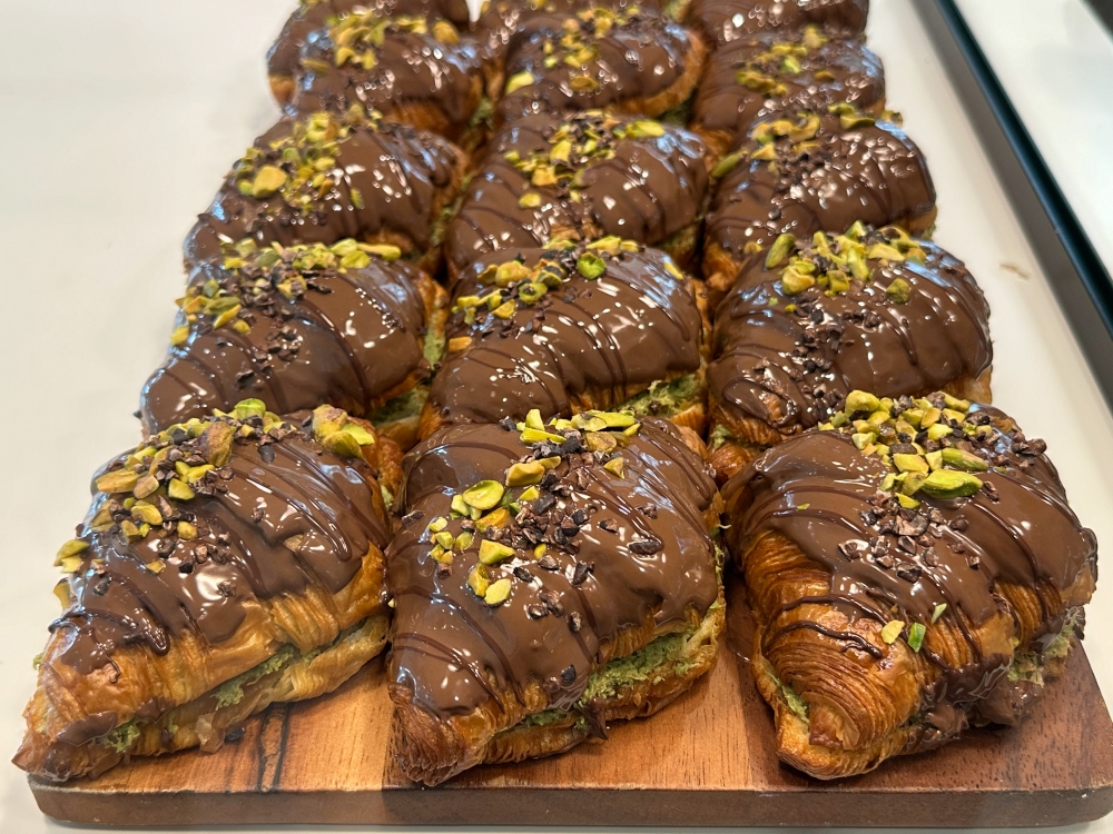 Osha & Terra Baklava Croissant has many devoted fans flocking there to wait for the sale of these chocolate covered croissants filled with pistachio ‘kunafa’ mixed with tahini. — Picture by Lee Khang Yi