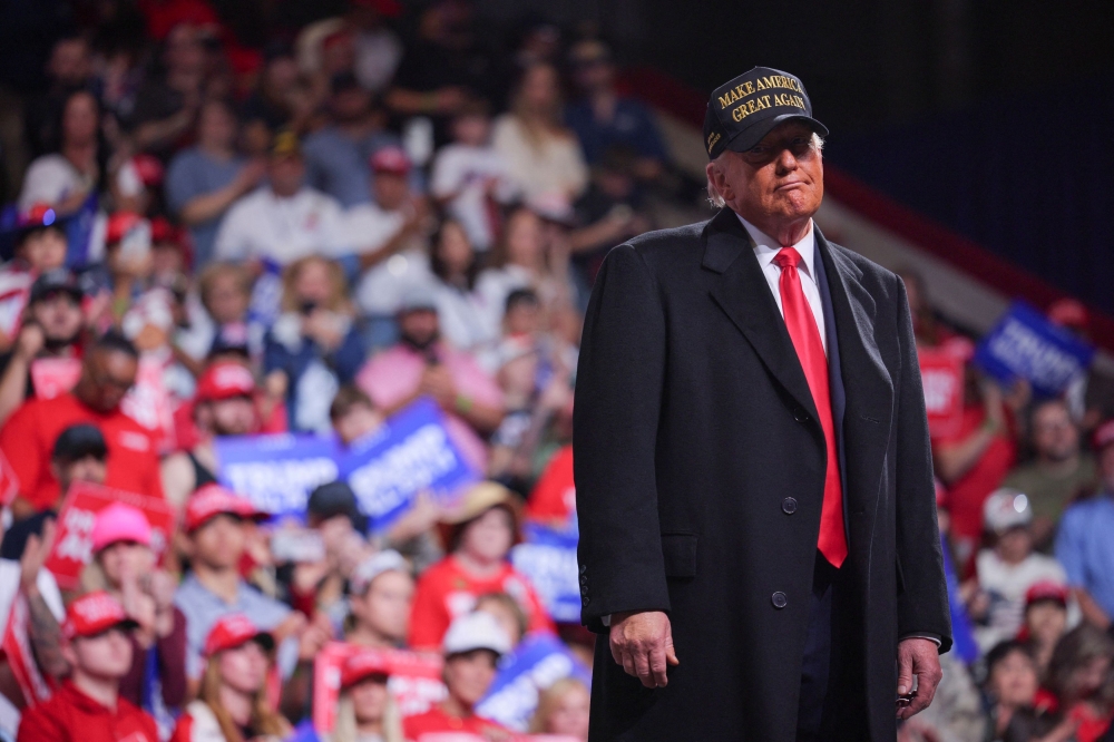 Republican presidential nominee and former US President Donald Trump reacts onstage during a rally at Atrium Health Amphitheater in Macon, Georgia, US, on November 3, 2024. — Reuters