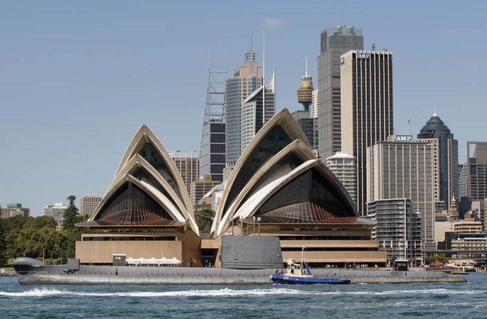 An undated file photograph shows a view of Sydney city with the iconic Sydney Opera House in the foreground. — Reuters pic