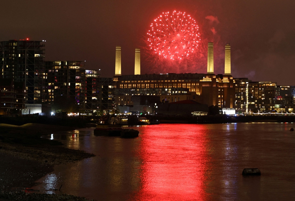 Fireworks, to mark bonfire night and the anniversary of the Guy Fawkes gunpowder plot of 1605 to blow up the Houses of Parliament, explode behind Battersea Power Station in London November 2, 2024. Malaysian companies, including the Employee Provident Fund, played a major role in the redevelopment of London’s Battersea Power Station, now featuring Malaysia Square for celebrations and events. — Reuters pic  