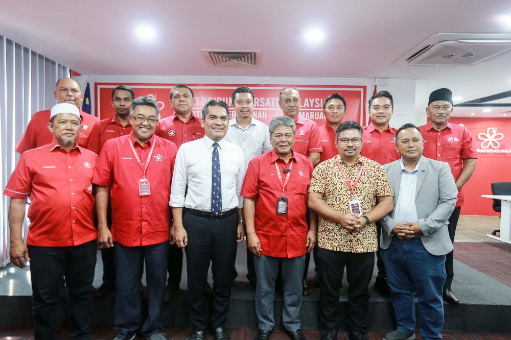 Chairman of the Bersatu Election Committee Datuk Seri Abdul Azim Mohd Zabidi (middle) poses for a group photo with the Bersatu Supreme Leadership Council for the year 2024-2027 at Bersatu Headquarters in Petaling Jaya November 4, 2024. — Picture by Sayuti Zainudin