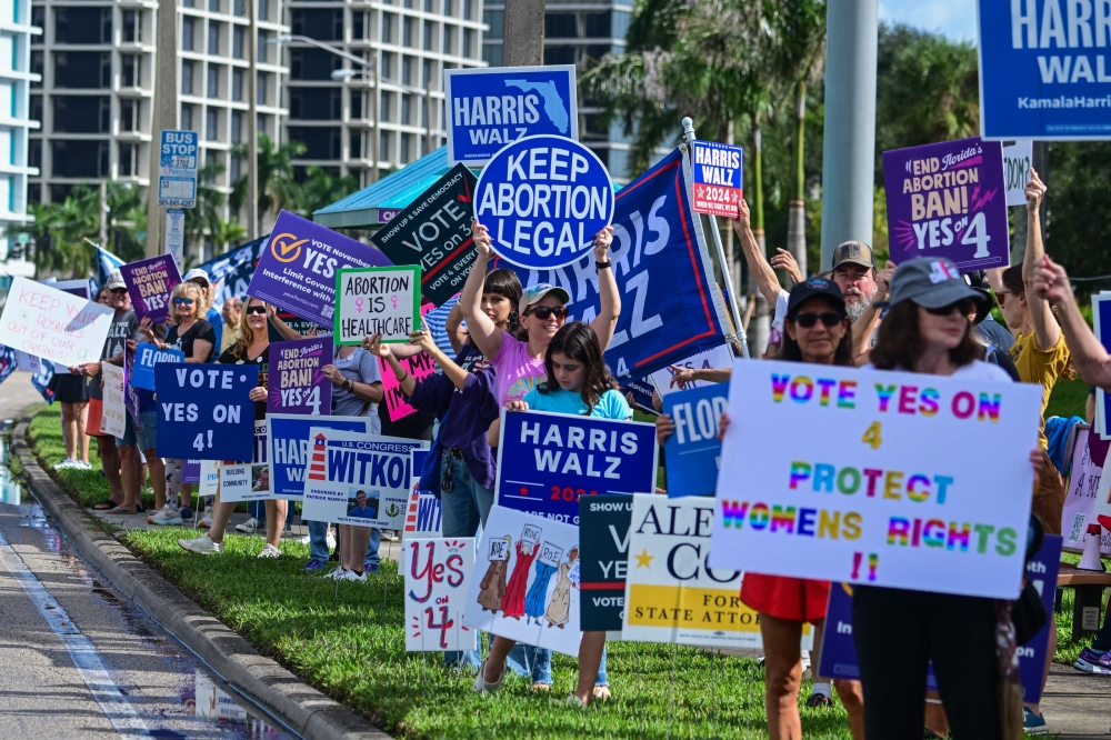 Demonstrators rally in support of reproductive rights and US Vice President and Democratic presidential candidate Kamala Harris during the National Women's March in West Palm Beach, Florida, on November 2, 2024. — AFP pic