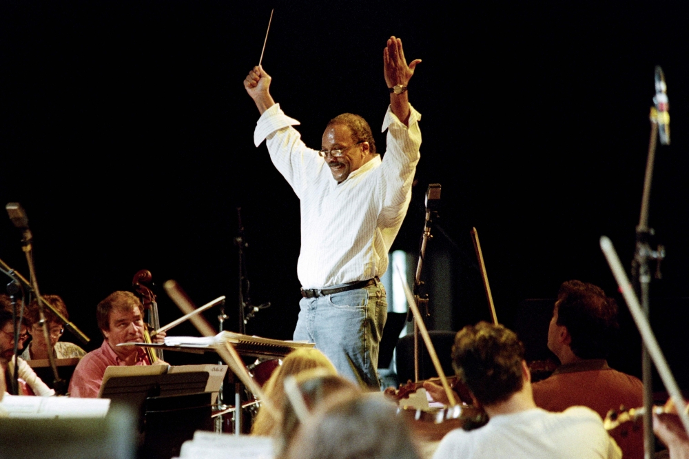 US conductor Quincy Jones rehearses with the Lille orchestra during the Montreux Jazz Festival, in Montreux on July 11, 1993. — AFP pic