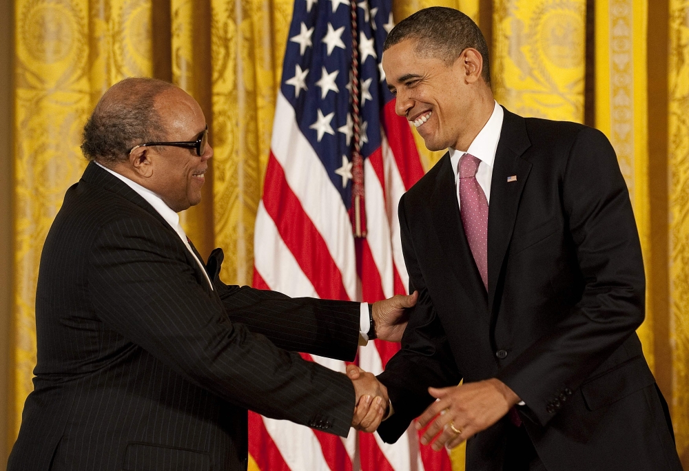 US President Barack Obama (right) awards the 2010 National Medal of Arts to American musician Quincy Jones during a ceremony at the White House in Washington, DC, on March 2, 2011. — AFP pic