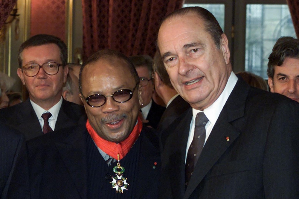 US music producer Quincy Jones (centre) poses with French President Jacques Chirac, after being awarded with the insigna of commander of the Legion of Honor as a foreigner, at the presidential Elysee Palace in Paris on March 26, 2001. — AFP pic