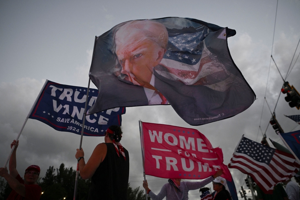 Supporters of Republican presidential nominee and former US President Donald Trump gather ahead of the US presidential election in West Palm Beach, Florida, US November 4, 2024. — Reuters