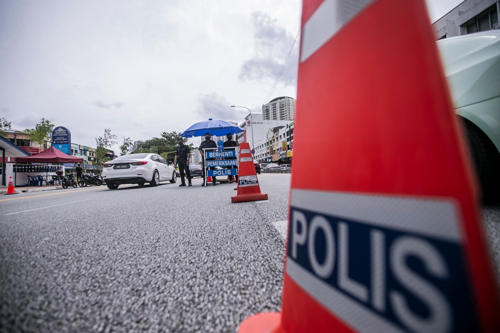 Police arrested a French national for aggressive behaviour, using offensive language, and obstructing officers from conducting a check during a roadblock in Bayan Indah near here last night. — Picture by Hari Anggara