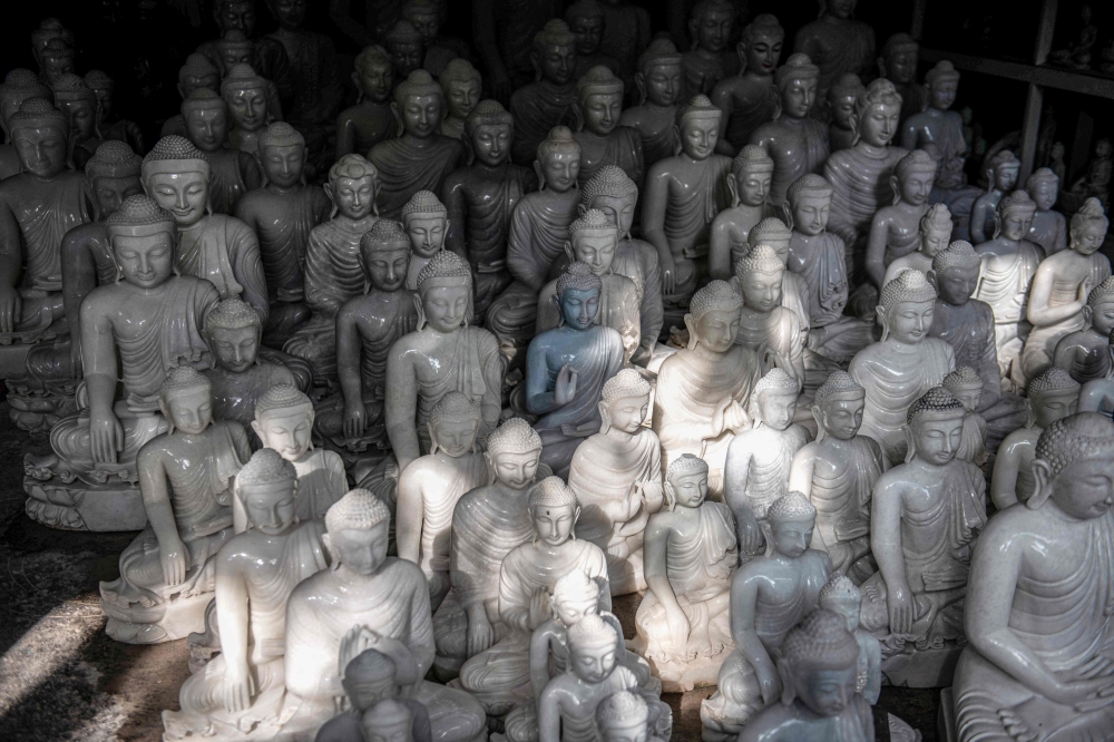 Sculptor Aung Naing Lin has spent decades carving Buddha statues to help guide Myanmar’s faithful. — AFP pic