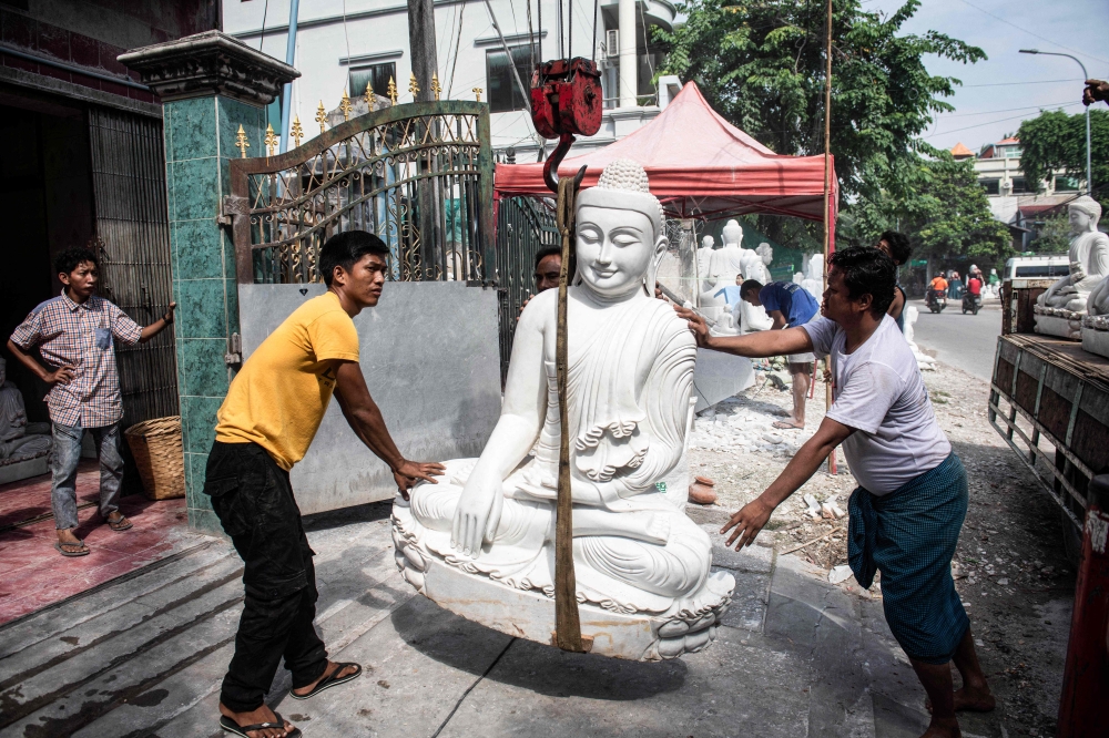 Now, moving the precious stone and roughly carved statues by truck across the divide of the civil war, from rebel to junta-held territory, is expensive, difficult and dangerous. — AFP pic